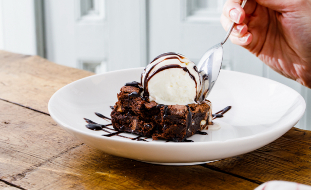 chocolate brownie with a scoop of ice cream