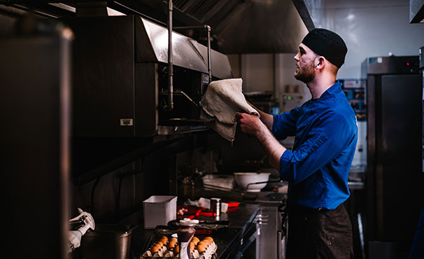 kitchen-staff-cleaning-equipment